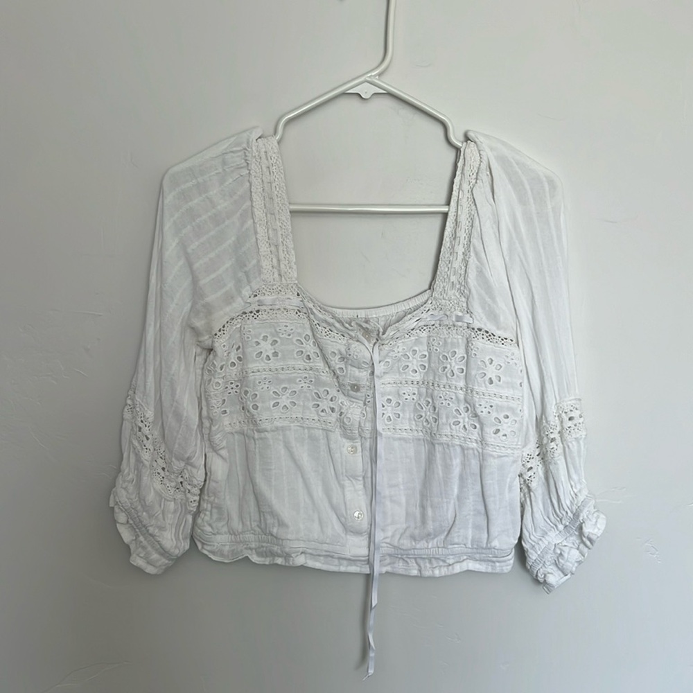 White American Eagle blouse top, puffy sleeves with lace and button details